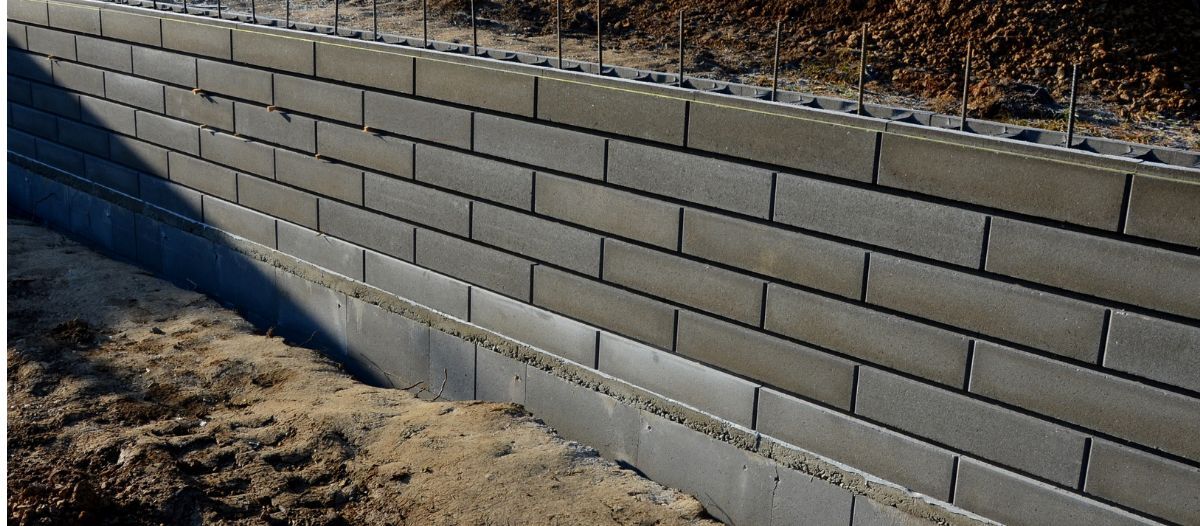 Mitigating risks from aging retaining walls
