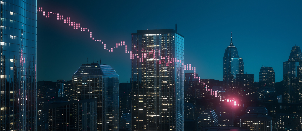 Nighttime cityscape with lights visible in their windows. A digital graph trending downwards in red is overlaid.